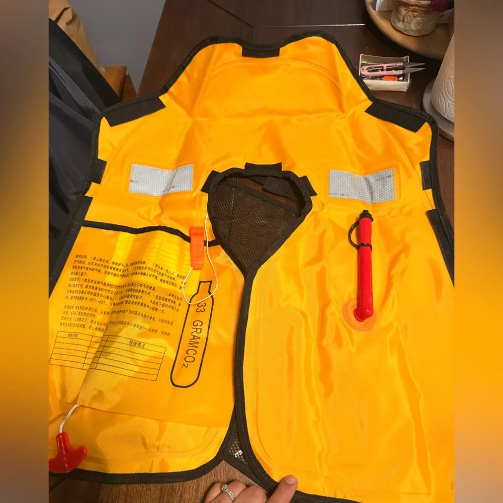 Water sports emergency self inflatable vest